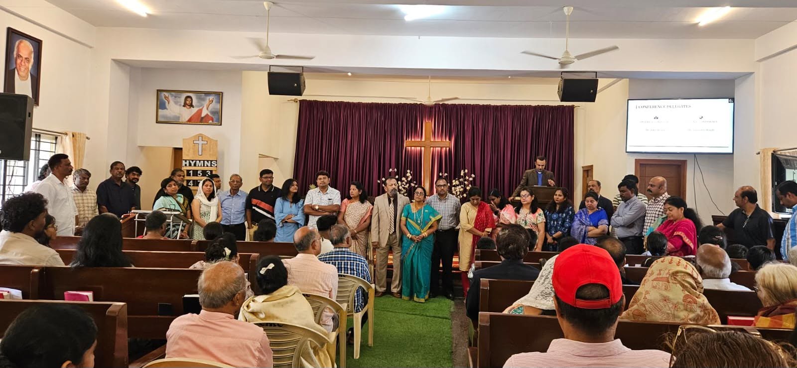 Christ Methodist Church committee members standing together in the sanctuary